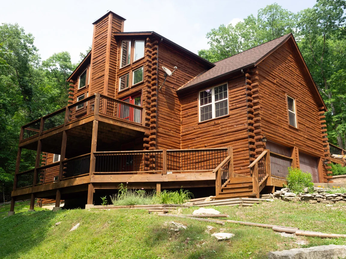 Restored log home in wooded setting