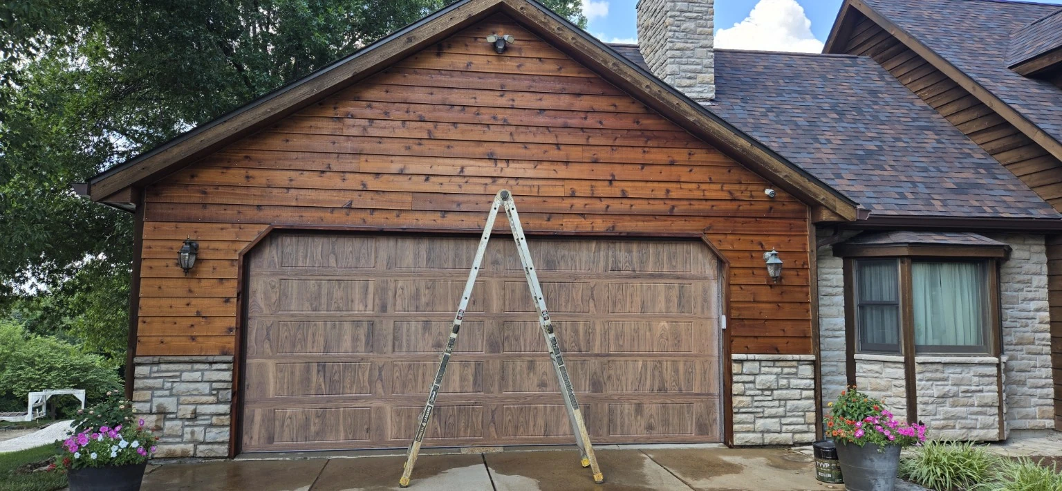 Cedar garage after the wood was darkened to better match the existing house