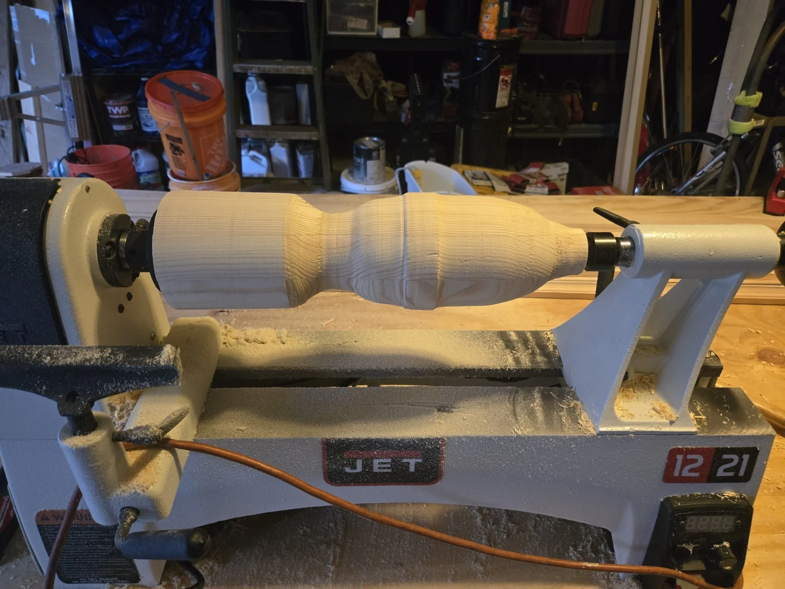 Custom architectural finial being turned on a wood lathe