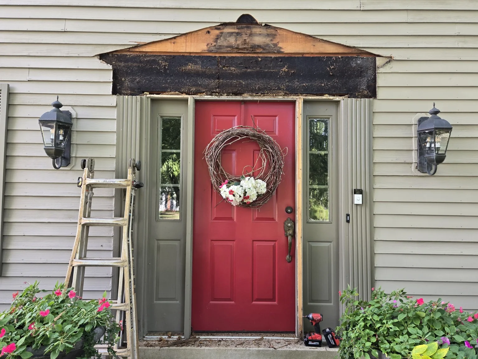Front entrance with deteriorated pediment removed, exposing the structure behind it