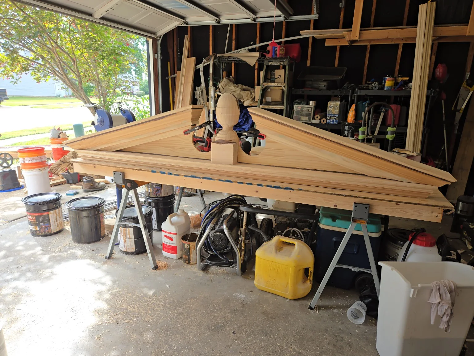 Large solid-wood replacement pediment being fitted together in the workshop